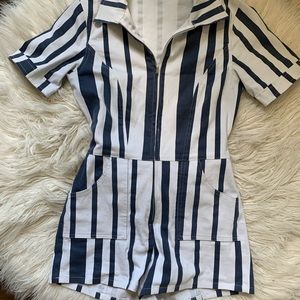 Fitted zip-up Olivacious Romper Flattering fit & short shorts to show the legs!